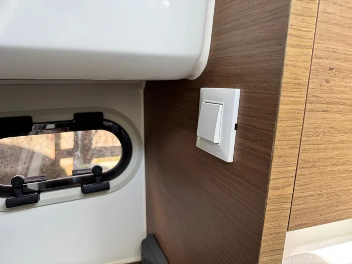  Yacht Photos Pics Interior of 2020 Jeanneau Leader 9.0 WA showing window and light switch.