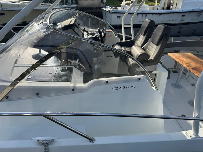  Yacht Photos Pics 2020 Jeanneau Leader 9.0 WA boat cockpit with dual seats and control panel.