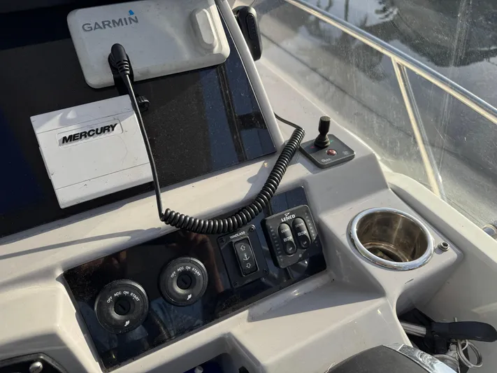 Yacht Photos Pics Control panel of 2020 Jeanneau Leader 9.0 WA with Garmin and Mercury equipment.