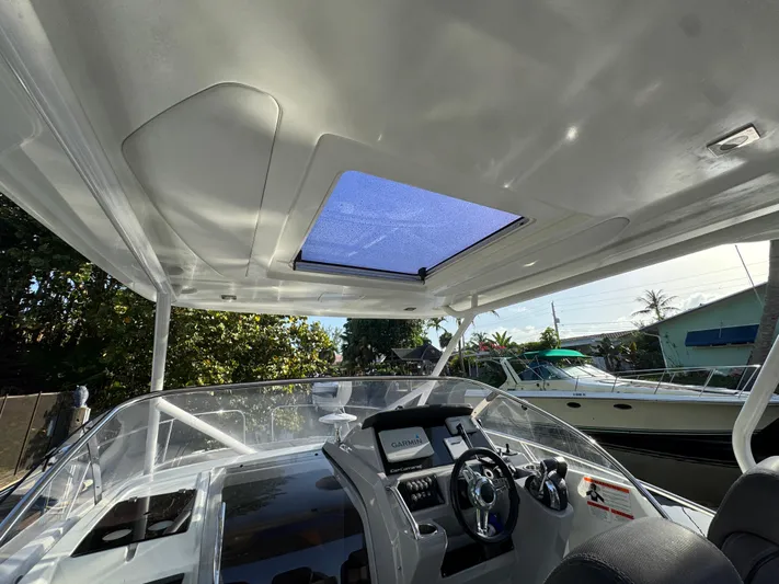  Yacht Photos Pics 2020 Jeanneau Leader 9.0 WA boat interior with steering wheel and navigation system.