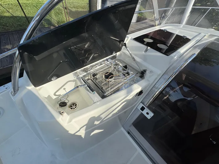  Yacht Photos Pics 2020 Jeanneau Leader 9.0 WA boat cockpit with stove and sink.