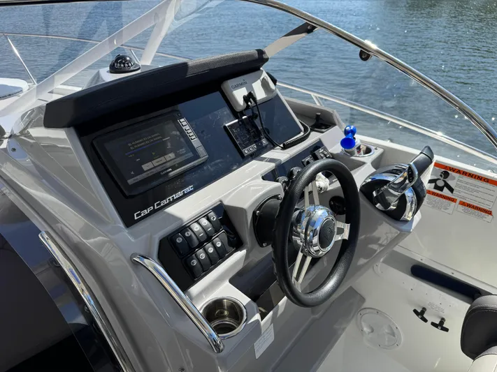  Yacht Photos Pics Cockpit of 2020 Jeanneau Leader 9.0 WA with modern controls and navigation system.