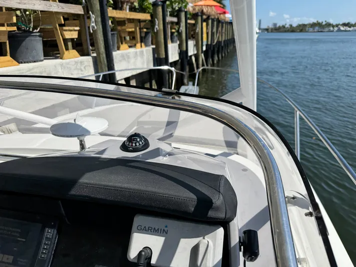  Yacht Photos Pics 2020 Jeanneau Leader 9.0 WA boat with Garmin navigation, docked by a wooden pier.