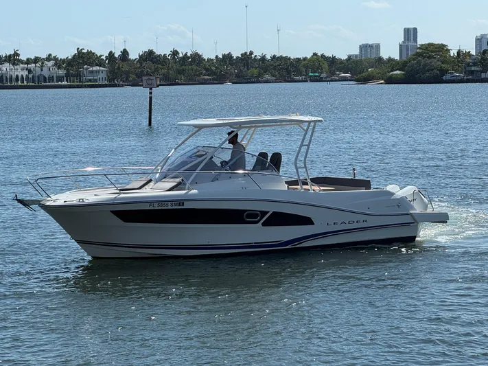  Yacht Photos Pics 2020 Jeanneau Leader 9.0 WA boat cruising on a sunny day in a scenic waterway.