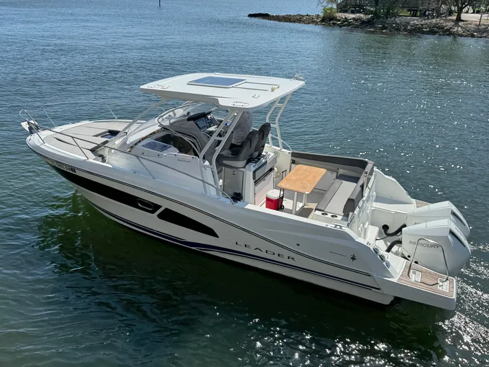  Yacht Photos Pics 2020 Jeanneau Leader 9.0 WA boat on calm water, featuring sleek design and spacious deck.
