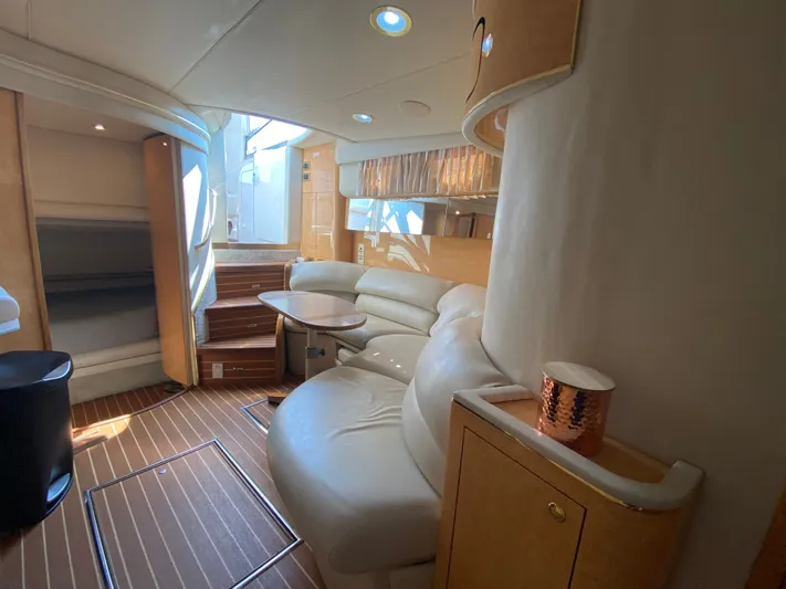  Yacht Photos Pics Luxurious interior of 1997 Sea Ray 450 Sundancer yacht with elegant seating and wooden flooring.