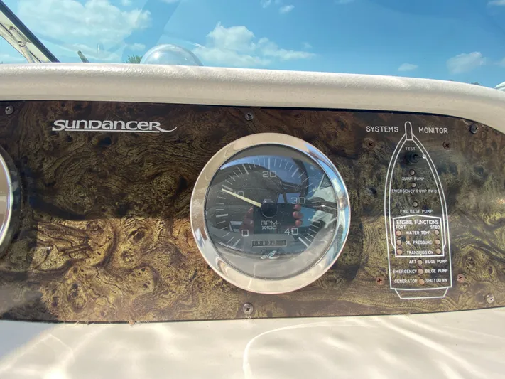  Yacht Photos Pics Dashboard of a 1997 Sea Ray 450 Sundancer boat with RPM gauge and system monitor.