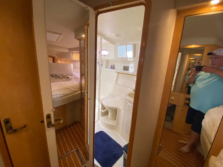  Yacht Photos Pics Interior of 1997 Sea Ray 450 Sundancer yacht showing bedroom and bathroom.