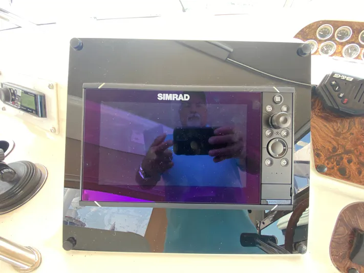  Yacht Photos Pics Simrad navigation system on 1997 Sea Ray 450 Sundancer yacht dashboard.