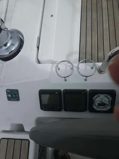 Far Star Yacht Photos Pics Beneteau Oceanis 41 cockpit controls, 2012 model, featuring navigation instruments and teak decking.