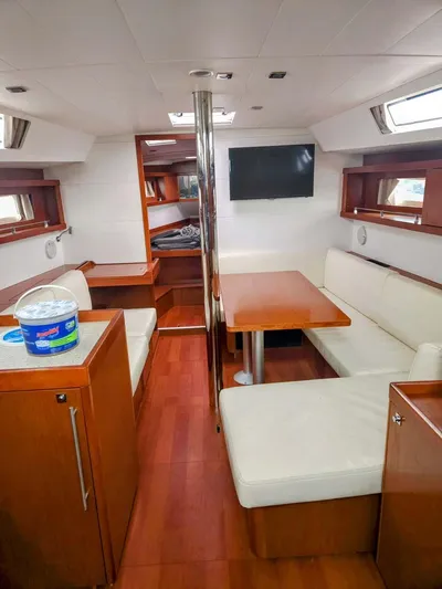 Far Star Yacht Photos Pics Interior of 2012 Beneteau Oceanis 41 sailboat with modern seating and wooden finishes.