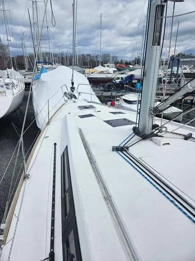 Far Star Yacht Photos Pics 2012 Beneteau Oceanis 41 sailboat on land, marina background, overcast sky.