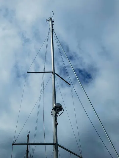 Far Star Yacht Photos Pics Mast of 2012 Beneteau Oceanis 41 sailboat against cloudy sky.