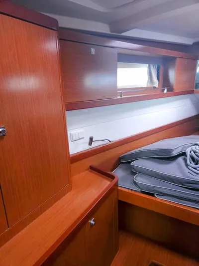 Far Star Yacht Photos Pics Interior cabin of 2012 Beneteau Oceanis 41 sailboat with wooden furnishings.