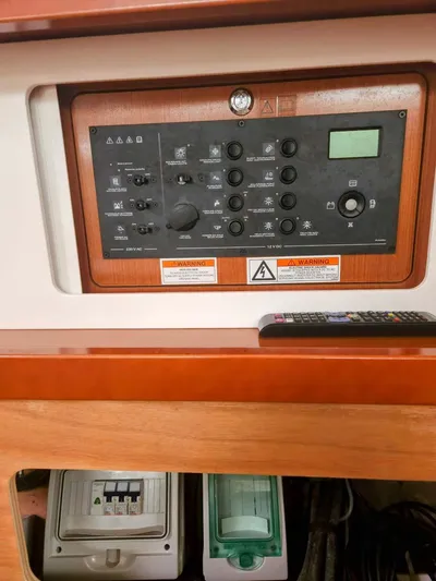 Far Star Yacht Photos Pics Control panel of 2012 Beneteau Oceanis 41 sailboat, featuring various switches and dials.