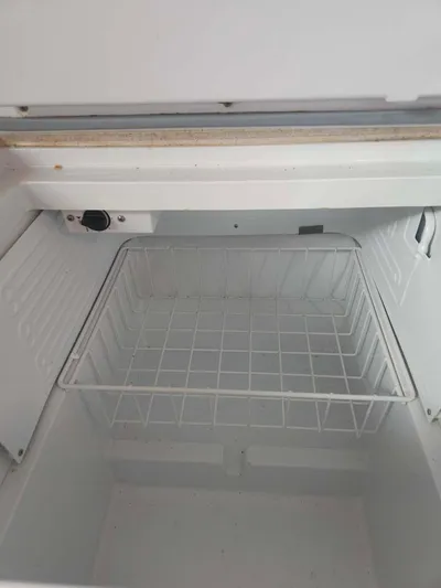 Far Star Yacht Photos Pics Empty freezer compartment on a 2012 Beneteau Oceanis 41 sailboat.