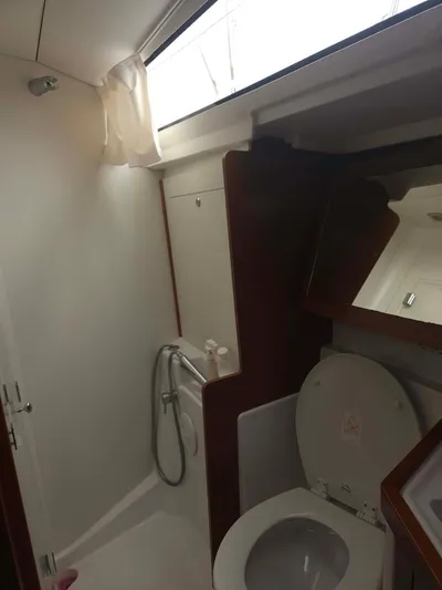 Far Star Yacht Photos Pics 2012 Beneteau Oceanis 41 yacht bathroom with toilet and shower.