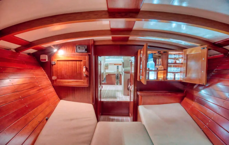  Yacht Photos Pics Interior of 2020 Custom Windlea Runabout with wooden paneling and cozy seating.