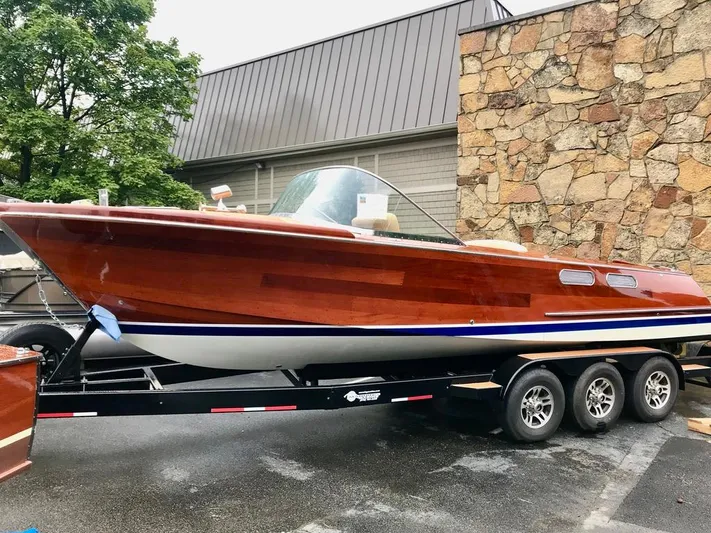  Yacht Photos Pics Custom 2020 Windlea Runabout boat on trailer, featuring sleek wooden design and triple-axle support.