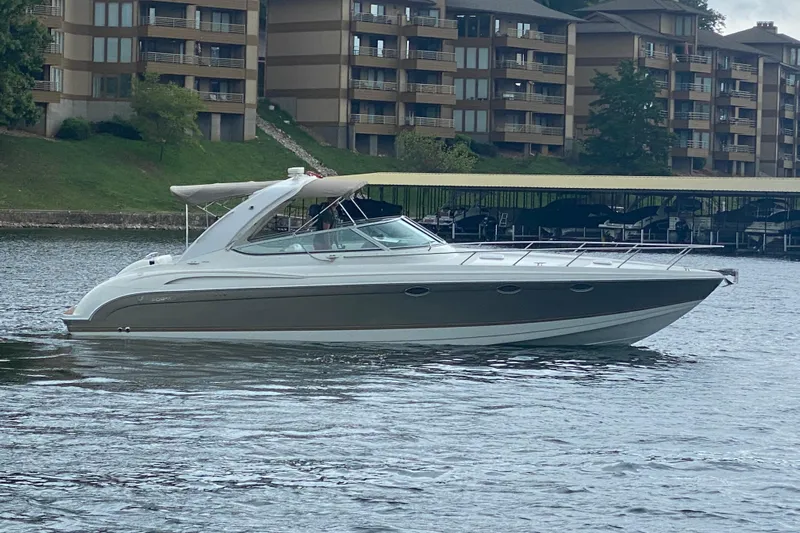  Yacht Photos Pics 2004 Formula 370ss boat on water near residential buildings.