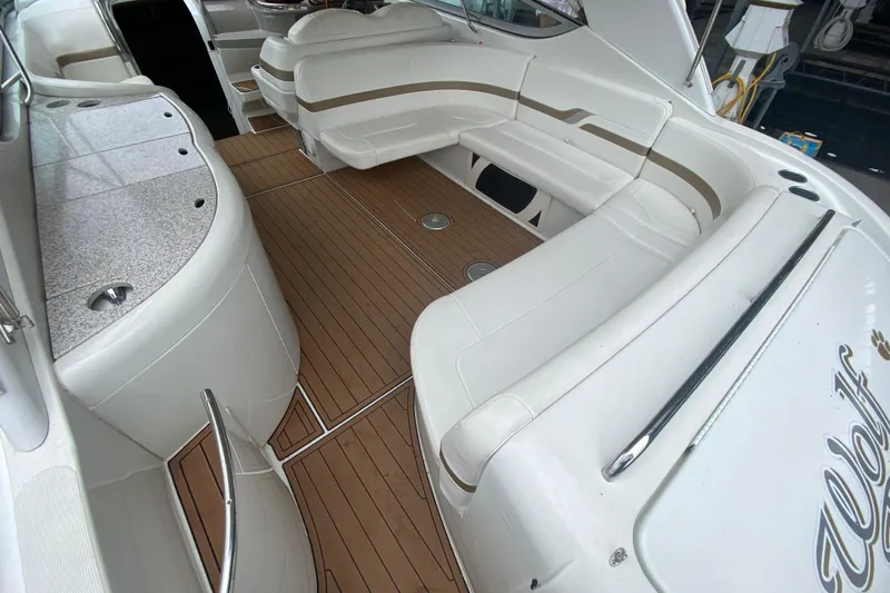  Yacht Photos Pics 2004 Formula 370ss boat interior with white seating and wood flooring.
