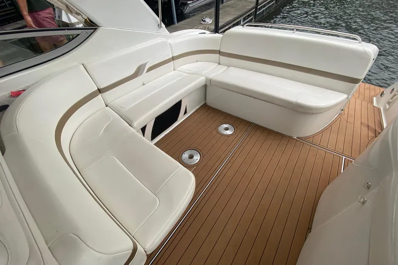  Yacht Photos Pics 2004 Formula 370ss boat interior with white seating and teak flooring.