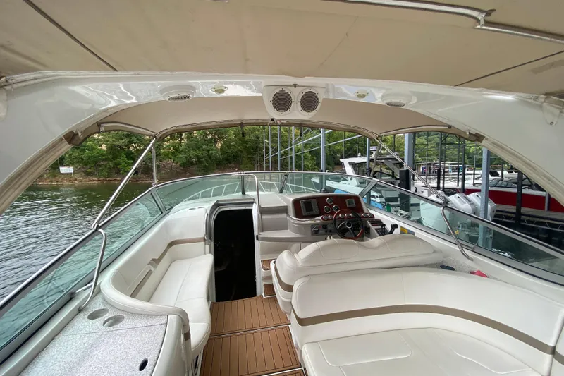  Yacht Photos Pics 2004 Formula 370ss boat interior with white seating and wooden flooring.