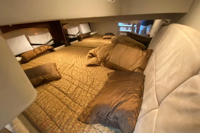  Yacht Photos Pics Interior cabin of 2004 Formula 370ss boat with cozy bedding and pillows.