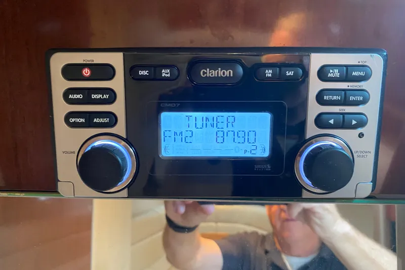  Yacht Photos Pics Clarion CMD7 stereo system in a 2004 Formula 370ss boat, displaying FM tuner.