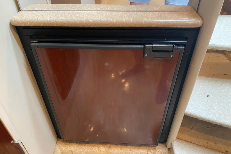  Yacht Photos Pics 2004 Formula 370ss boat interior with compact wooden cabinet and countertop.