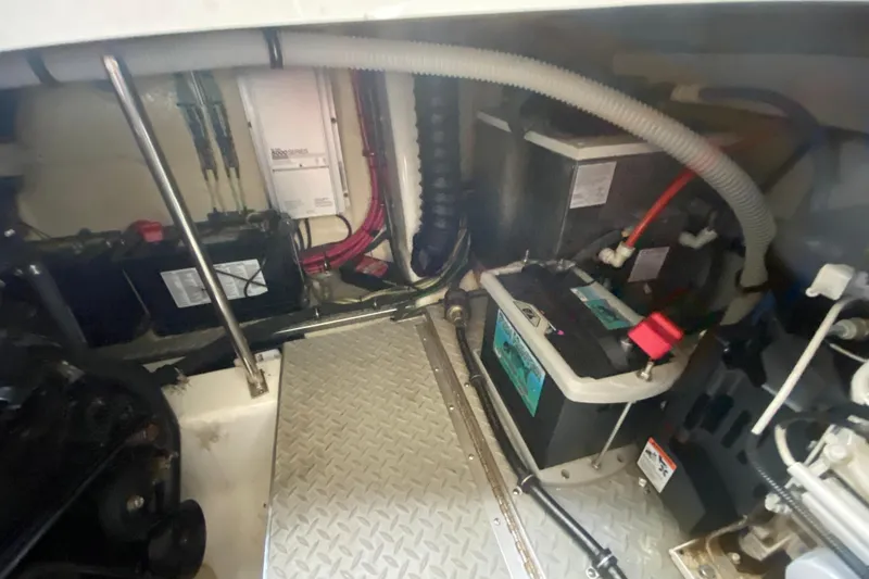  Yacht Photos Pics Engine compartment of a 2004 Formula 370ss boat, featuring batteries and wiring.