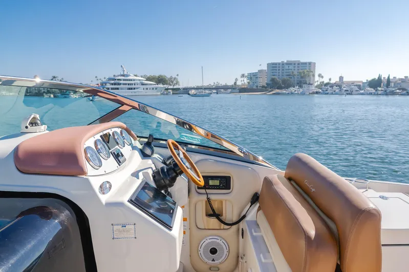 Dream Chaser Yacht Photos Pics 2006 Chris-Craft Corsair 36 boat dashboard with waterfront view.