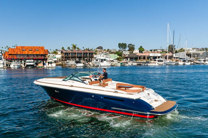 Dream Chaser Yacht Photos Pics 2006 Chris-Craft Corsair 36 cruising in a scenic marina setting.