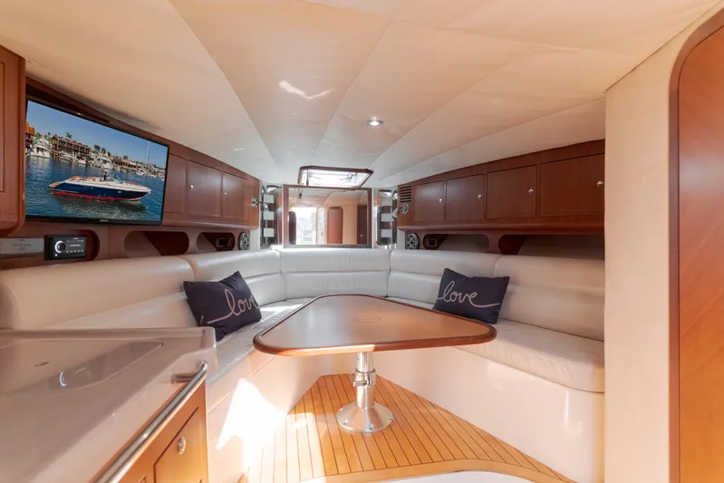 Dream Chaser Yacht Photos Pics Luxurious interior of 2006 Chris-Craft Corsair 36 yacht with elegant seating and wooden accents.