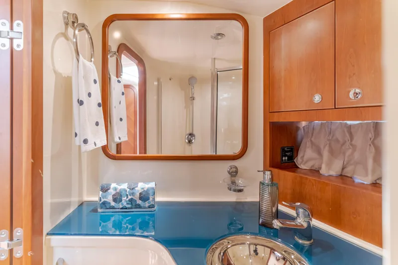 Dream Chaser Yacht Photos Pics Luxurious bathroom in 2006 Chris-Craft Corsair 36 yacht with modern fixtures.