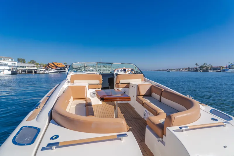 Dream Chaser Yacht Photos Pics 2006 Chris-Craft Corsair 36 luxury boat with spacious seating on a sunny day.