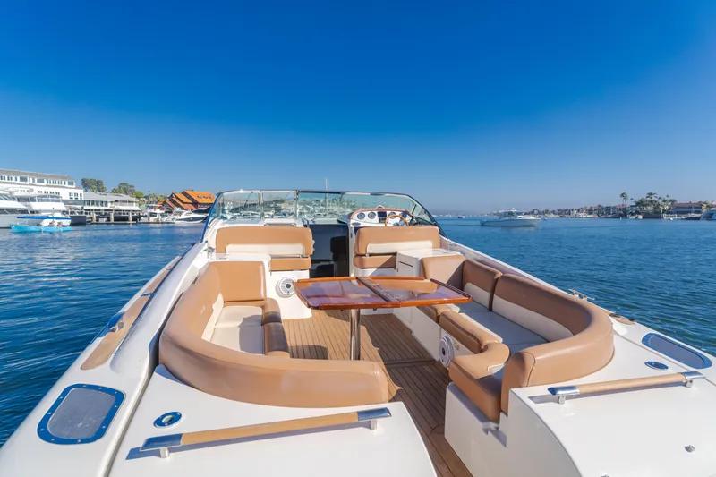 Dream Chaser Yacht Photos Pics 2006 Chris-Craft Corsair 36 luxury boat with elegant seating on a sunny day.