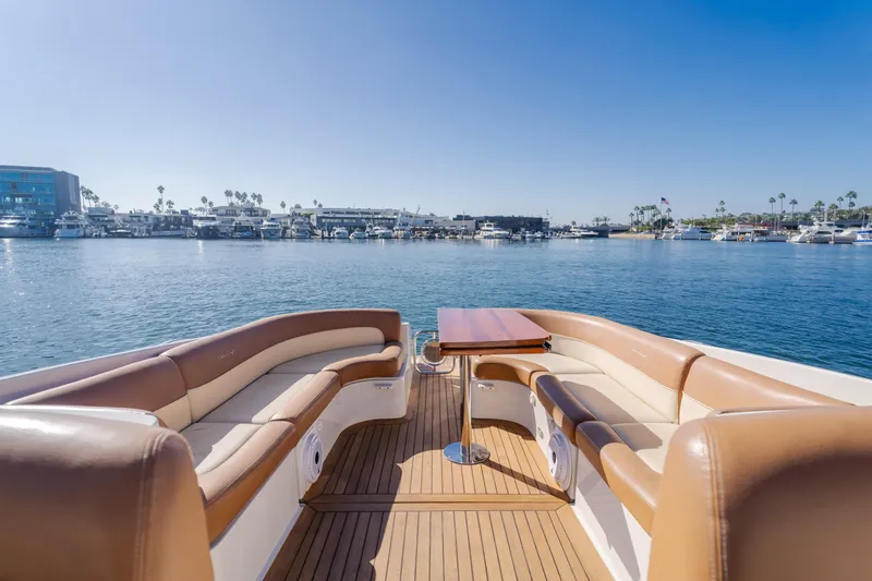 Dream Chaser Yacht Photos Pics Luxurious 2006 Chris-Craft Corsair 36 boat with elegant seating and scenic marina view.