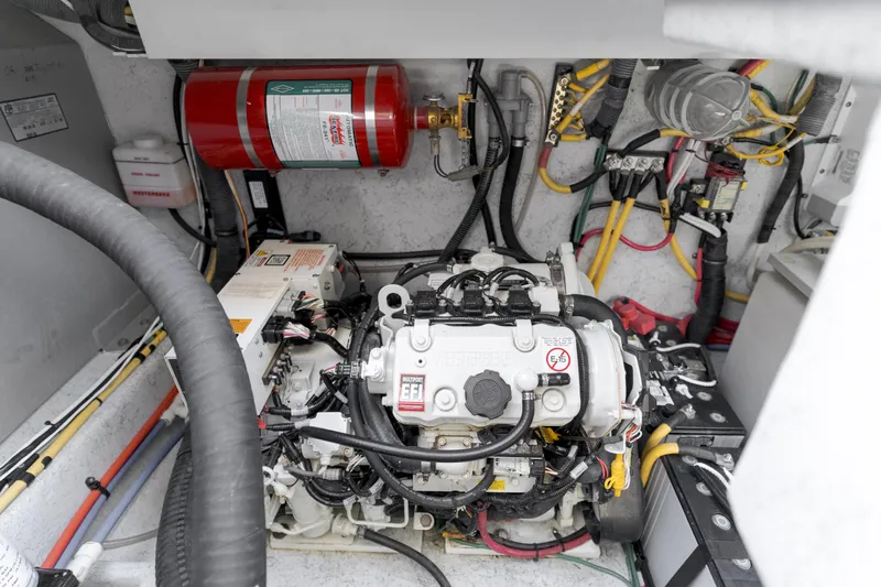 Dream Chaser Yacht Photos Pics Engine compartment of 2006 Chris-Craft Corsair 36, featuring wiring and fire extinguisher.