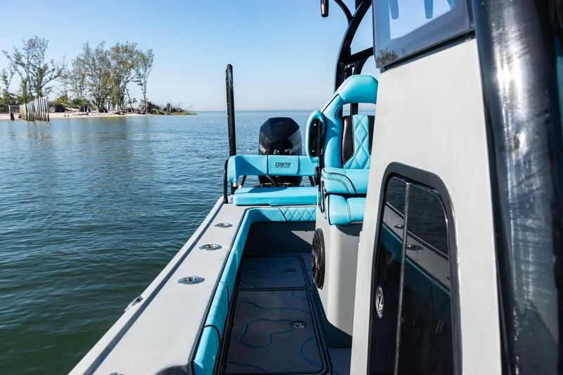  Yacht Photos Pics 2022 Costa Custom Boats 264 on calm water, featuring sleek design and vibrant seating.