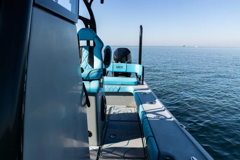  Yacht Photos Pics 2022 Costa Custom Boats 264 on calm ocean waters, featuring stylish seating and modern design.