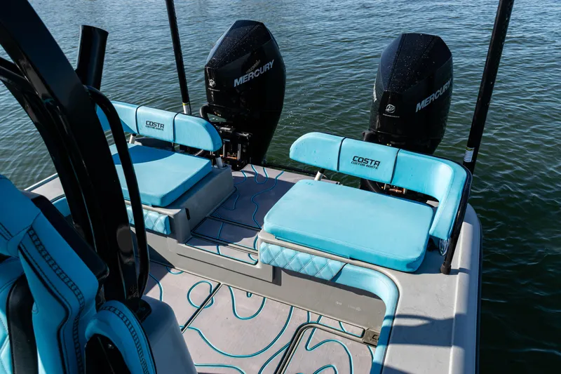  Yacht Photos Pics 2022 Costa Custom Boats 264 with Mercury engines, featuring blue seating on calm water.