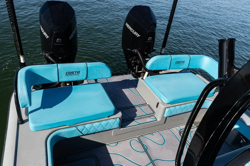  Yacht Photos Pics 2022 Costa Custom Boats 264 with twin Mercury engines and blue seating on the water.