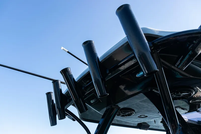  Yacht Photos Pics 2022 Costa Custom Boats 264, rod holders on sleek black structure against blue sky.