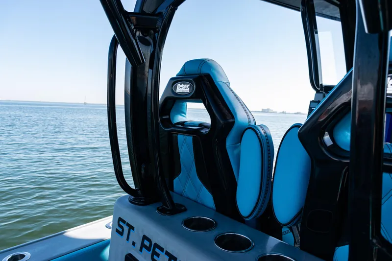  Yacht Photos Pics 2022 Costa Custom Boats 264 interior with blue seating, overlooking calm waters.