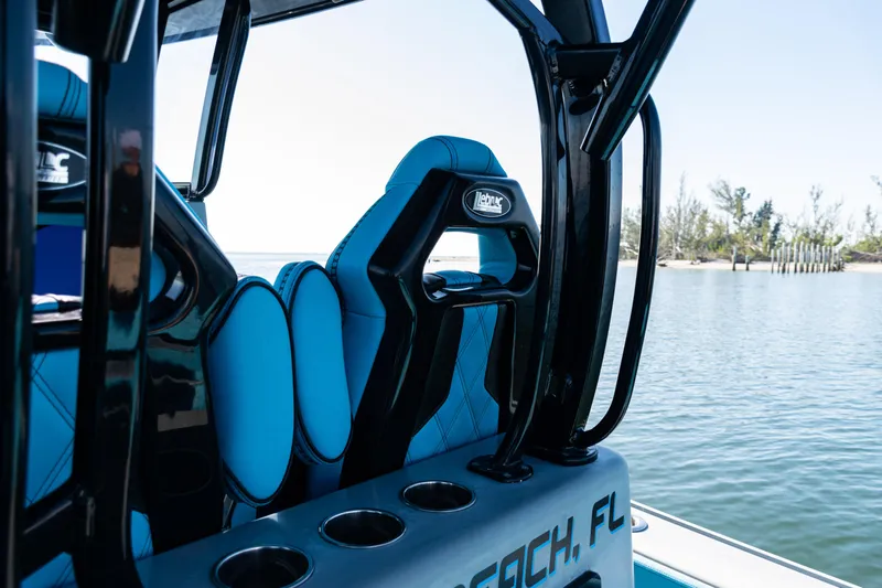  Yacht Photos Pics 2022 Costa Custom Boats 264 interior with blue seating, cup holders, and scenic water view.