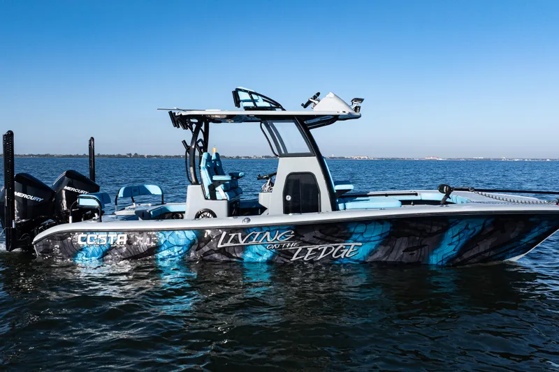  Yacht Photos Pics 2022 Costa Custom Boats 264 on water, vibrant blue design, twin Mercury engines.