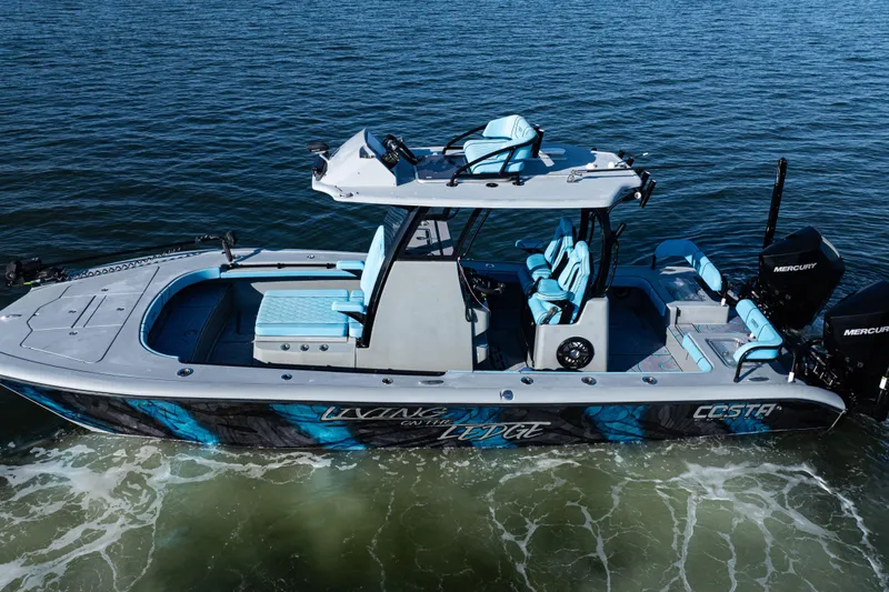  Yacht Photos Pics 2022 Costa Custom Boats 264 on water, featuring sleek design and vibrant blue accents.