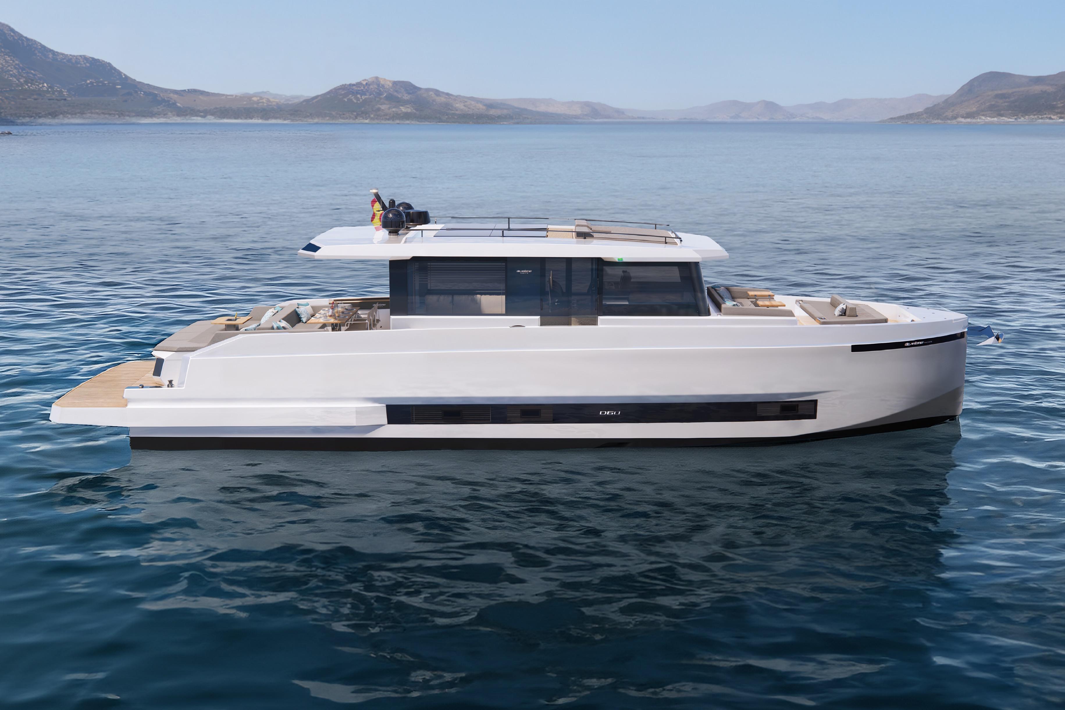 2026 De Antonio Yachts D60 luxury yacht on calm sea with scenic mountain backdrop.
