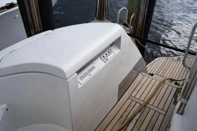 Chopin Yacht Photos Pics 2007 Pershing 62' yacht deck with wooden flooring and water view.